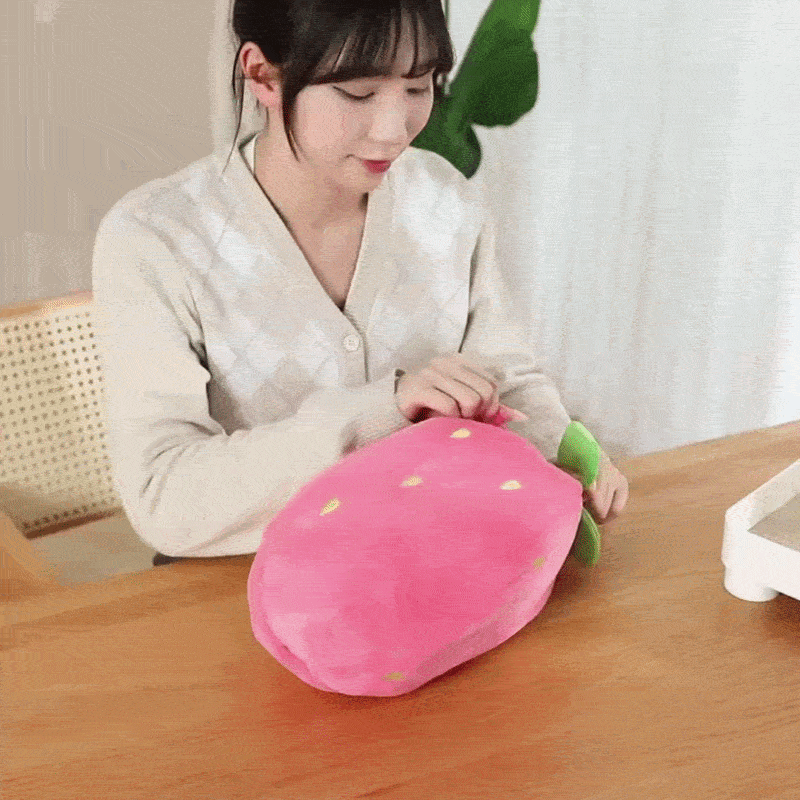 GIF showing a woman unzipping a Strawberry plush to reveal a Reversible Bunny with long ears - Viral Kawaii Plushie - Octoplush