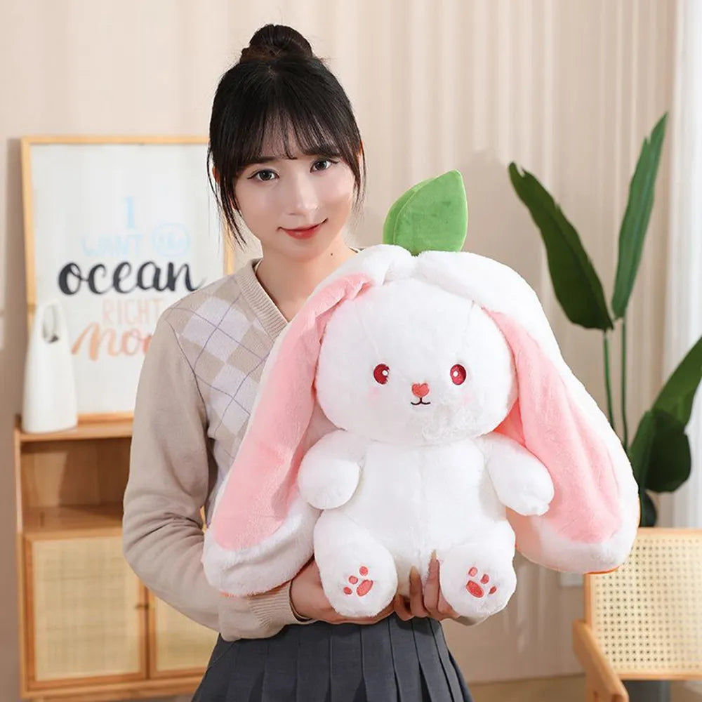 Woman holding a large Reversible Strawberry Bunny Plush - Adorable Stuffed Animal for Gifts - Octoplush Kawaii Plushie