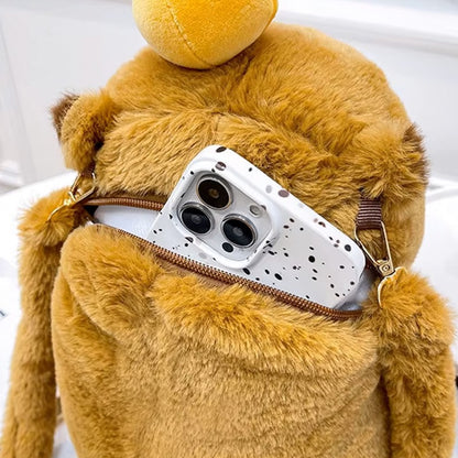 Capybara backpack open zipper pocket with smartphone inside, showing its soft plush material and size.