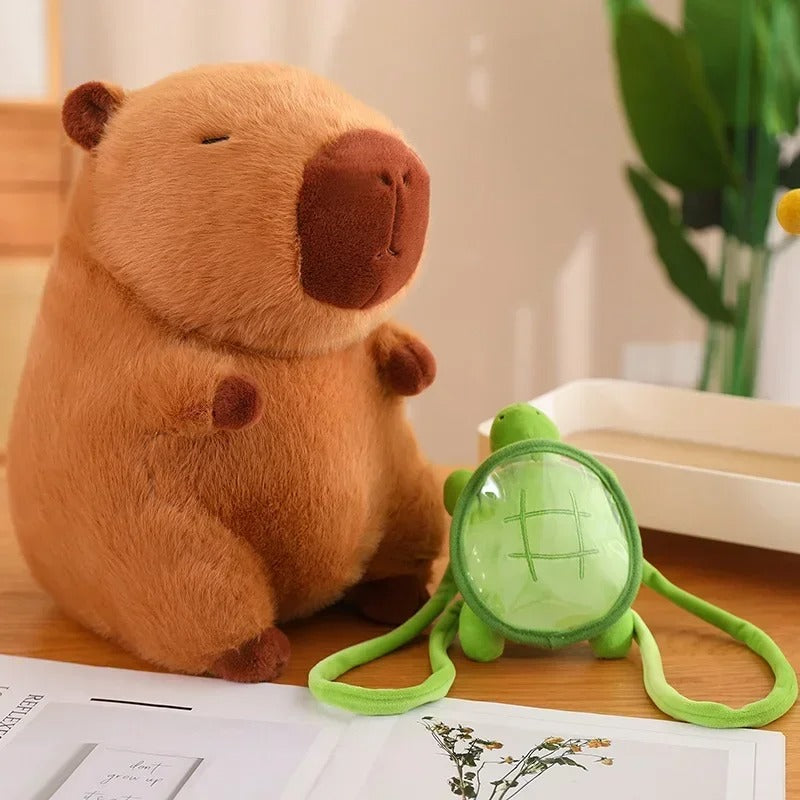 Capybara plush with turtle backpack removed and placed beside it – shows detachable design of this fun and giftable plush toy.