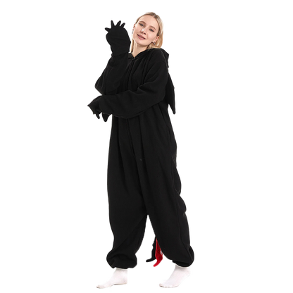Adult black dragon onesie kigurumi with claw gloves, wings, and tail. Perfect dragon onesie for kigurumi fans seeking comfort and playful style