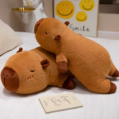 Two large capybara plush toys stacked on a bed, showcasing soft texture and lifelike design.